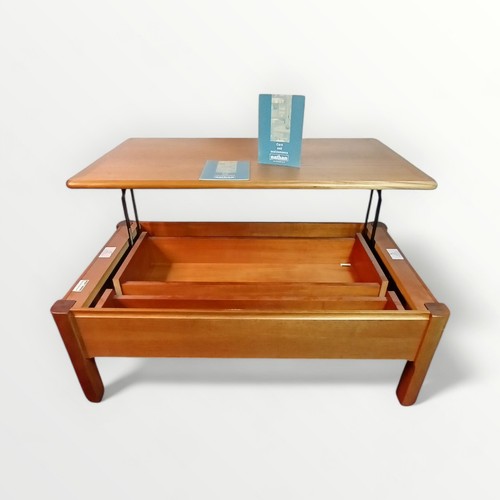 186 - Nathan Furniture metamorphic teak coffee table having a rising top revealing storage interior. 41 x ... 