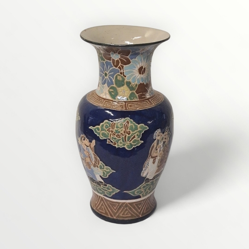 190 - Large Oriental pottery vase decorated with figures, 52cm high.