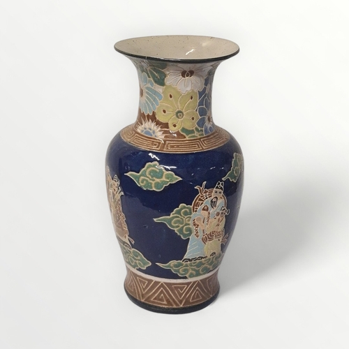 190 - Large Oriental pottery vase decorated with figures, 52cm high.