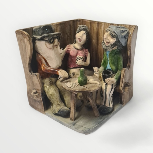 273 - Alan Young, a pottery group of Devonians on a tavern settle, 13cm high. Shipping group (A).