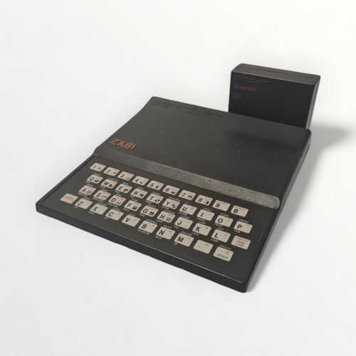 280 - Original Sinclair ZX81 home computer with manuals, memory expansion device and tape cassette program... 