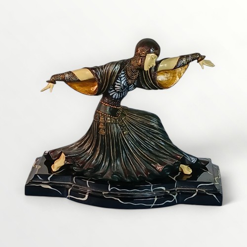 292 - 'Art Deco' design dancing female figure on a marble effect plinth. 30cm high. Shipping group (A)