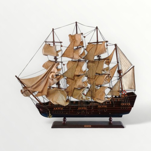 293 - Tabletop model Spanish galleon in full sail on a plinth base. 69cm high.