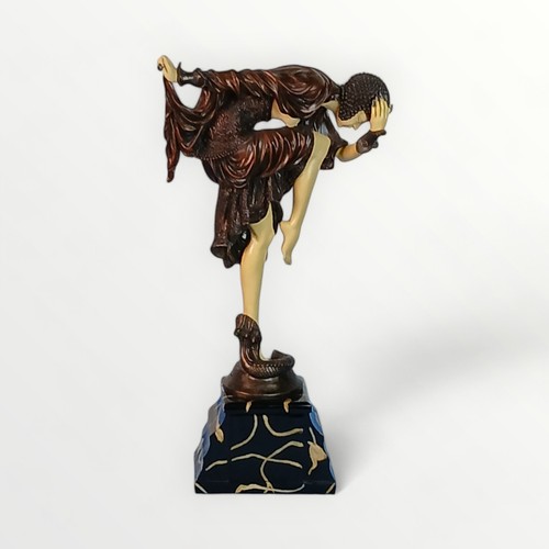 296 - 'Art Deco' design dancing female figure on a stepped marble effect plinth. 46cm high. Shipping group... 