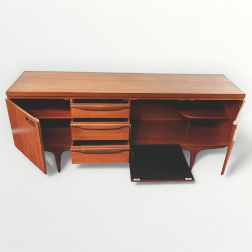 299 - Retro teak long and low sideboard having three drawers and three doors, one is fall down. Standing o... 