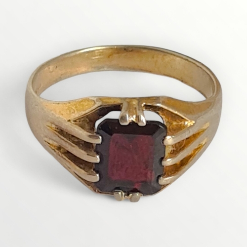 27 - Gold on silver garnet set signet ring, size R. Shipping group (A).