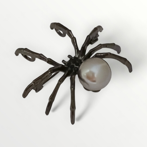 34 - Gun metal and simulated pearl spider brooch. Shipping group (A).