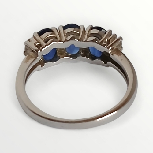 38 - 925 silver ring, set with blue and clear stones, size K.  Shipping group (A).