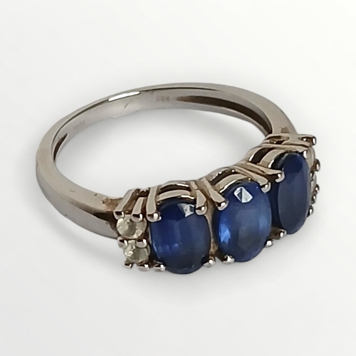 38 - 925 silver ring, set with blue and clear stones, size K.  Shipping group (A).