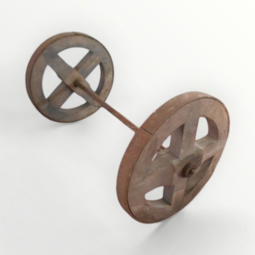 307 - A pair of iron shod wooden wheels on an axle, 61cm wide.