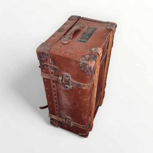 293 - Large Featherweight Flaxite Fibre 1930/40's travelling trunk, leather bound with strapping. Having t... 