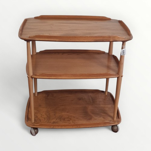 269 - Ercol Windsor 458 three tier serving trolley, labelled with original castors. 76 x 71 x 46cm.