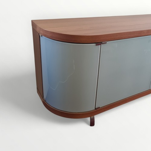 305 - Italian designer side board having four glass doors of bowed form, standing on short metal legs. 83 ... 