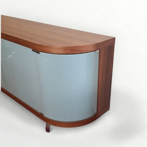 305 - Italian designer side board having four glass doors of bowed form, standing on short metal legs. 83 ... 