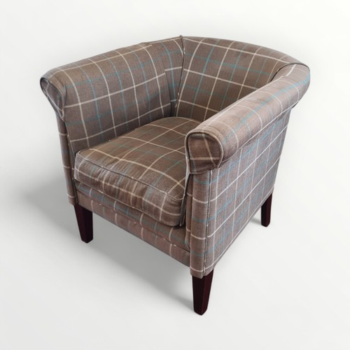 307 - Modern check upholstered tub chair on plain legs. 76cm overall height and fire regulation compliant.