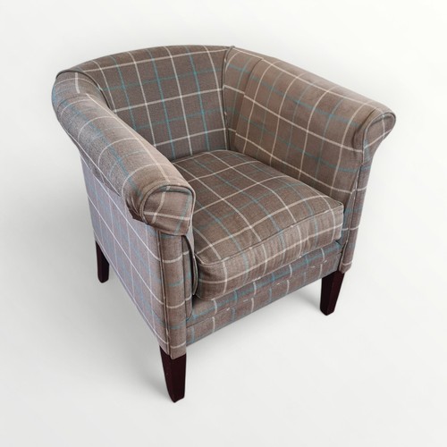 307 - Modern check upholstered tub chair on plain legs. 76cm overall height and fire regulation compliant.