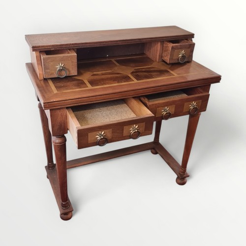 311 - Modern multi wood writing table with upstand over two inline drawers, four turned legs united with a... 