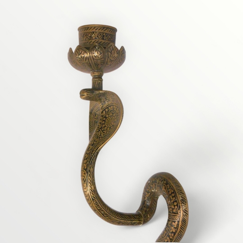 101 - Decorative brass 'Cobra' wall mounting candlestick, 76cm long.