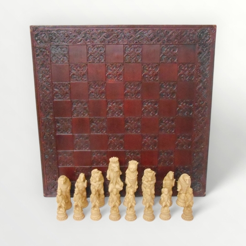 283 - Cast resin 'Reynard' animalier chess set and board. The king 20cm high. Shipping Group (A).