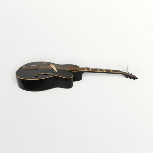 288 - 1930's acoustic guitar having a deep profile and fancy 'f' shape sound holes. 17 fret neck and an ad... 