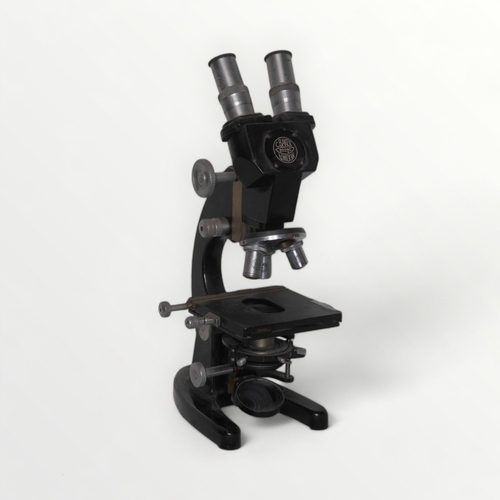 291 - C. Baker of London a binocular microscope with four lens turret and two way adjustable stage. Plano-... 