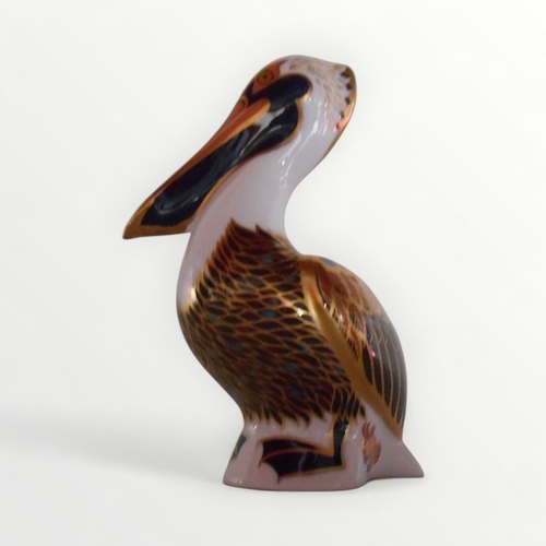 361 - Royal Crown Derby 'Brown Pelican' paperweight with gold button, 13cm high. Shipping group (A).