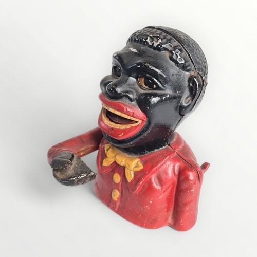 357 - Painted cast aluminium 'happy man' money bank, 16cm high. Shipping group (A).This item is listed on ... 