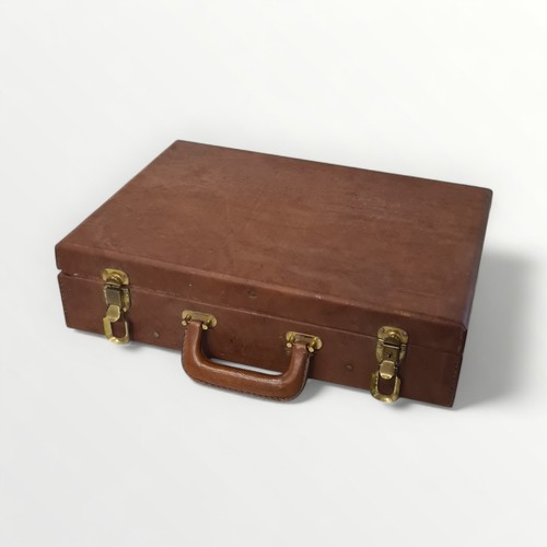 317 - DIY tools housed in a tan leather carry case. Shipping group (B).