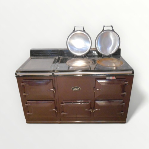 109A - An as new AGA gas and electric range cooker, in aubergine enamelled finish, having three hot plates,... 