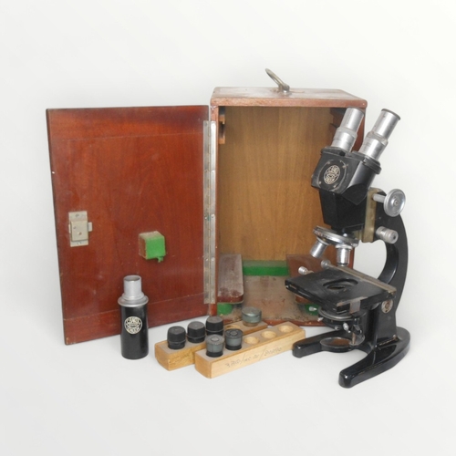 128 - C. Baker of London a binocular microscope with four lens turret and two way adjustable stage. Plano-... 