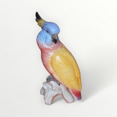 38 - Large Beswick model Cockatoo (1180) on undecorated stump, 29cm high. Shipping group (A).