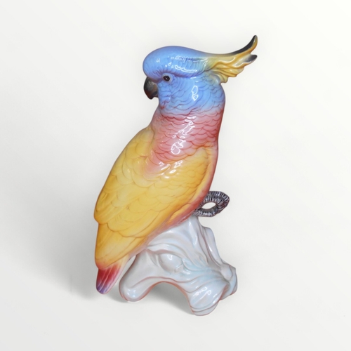 38 - Large Beswick model Cockatoo (1180) on undecorated stump, 29cm high. Shipping group (A).