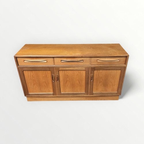 132 - G Plan teak sideboard three drawers over three cupboard doors. 76 x 142 x 45cm.