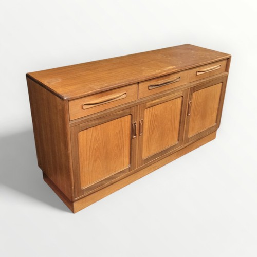 132 - G Plan teak sideboard three drawers over three cupboard doors. 76 x 142 x 45cm.