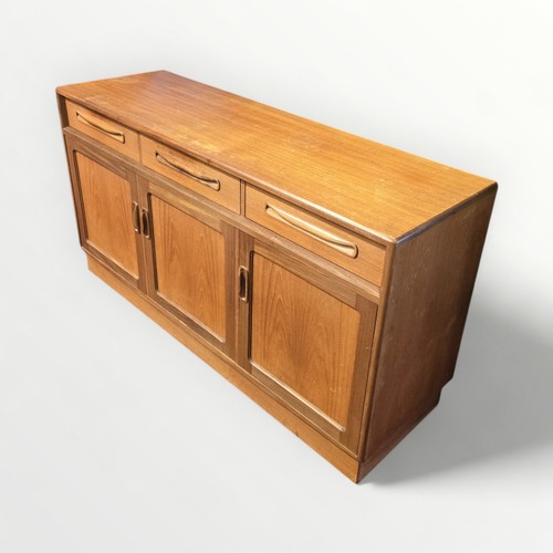 132 - G Plan teak sideboard three drawers over three cupboard doors. 76 x 142 x 45cm.