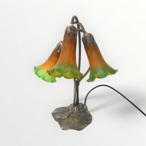 9 - An Art Nouveau Tiffany style table lamp, 41cm high.