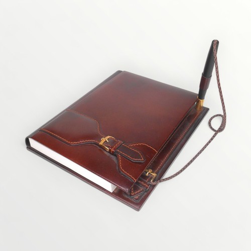 14 - Rolex branded leather covered desk top note pad and pen, 31cm deep. Shipping group (A).