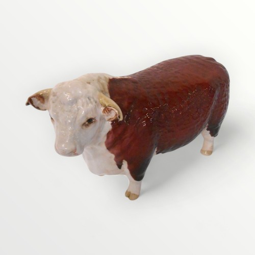 36 - Beswick model 'Champion of Champions' Hereford bull, 11.5cm high. Shipping group (A).