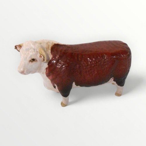 36 - Beswick model 'Champion of Champions' Hereford bull, 11.5cm high. Shipping group (A).