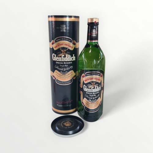 44 - Glenfiddich special reserve single malt Scotch whisky, one litre bottle with display tube. Shipping ... 