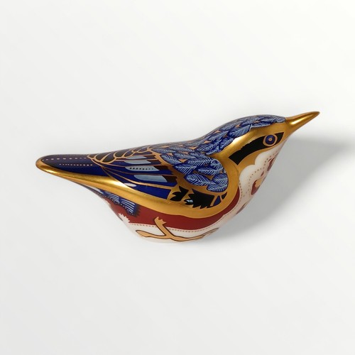 40 - Royal Crown Derby 'Nuthatch' paperweight havinggold button, 11.5cm long. Shipping group (A).