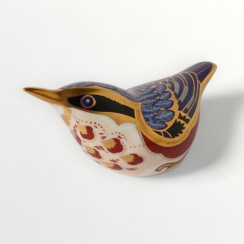 40 - Royal Crown Derby 'Nuthatch' paperweight havinggold button, 11.5cm long. Shipping group (A).