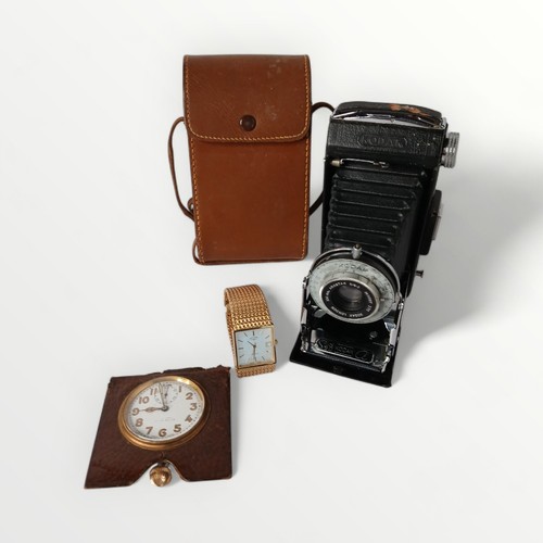 48 - Three items of vintage collectables; two time pieces and one cased camera. Shipping group (A).