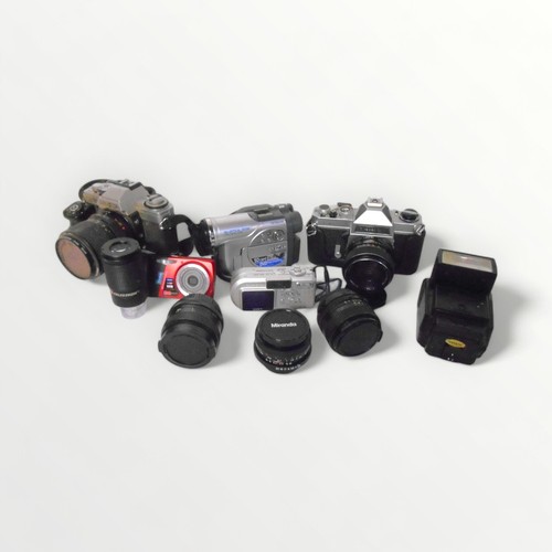 385 - A selection of cameras, lenses and accessories. Shipping group (A).