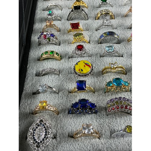 46 - Dealers Tray of Dress Rings - 100 rings of various designs and sizes. Gold and Silver tones with a v... 