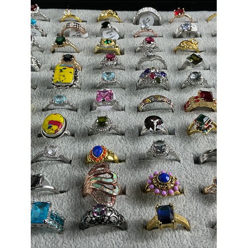 46 - Dealers Tray of Dress Rings - 100 rings of various designs and sizes. Gold and Silver tones with a v... 