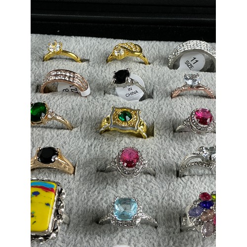 46 - Dealers Tray of Dress Rings - 100 rings of various designs and sizes. Gold and Silver tones with a v... 