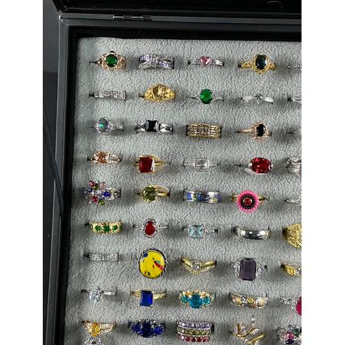 46 - Dealers Tray of Dress Rings - 100 rings of various designs and sizes. Gold and Silver tones with a v... 