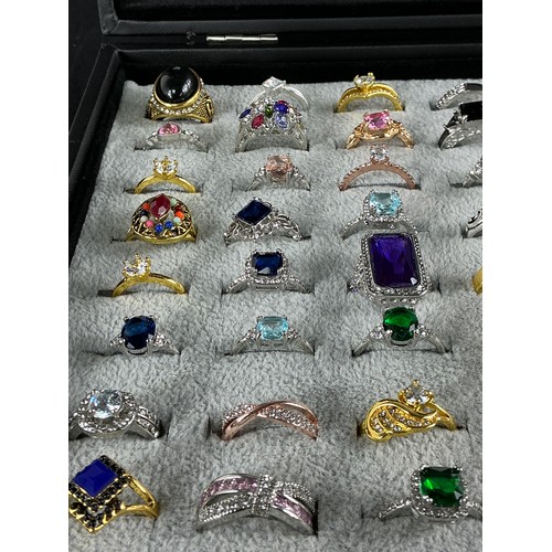 47 - Dealers Tray of Dress Rings - 100 rings of various designs and sizes. Gold and Silver tones with a v... 