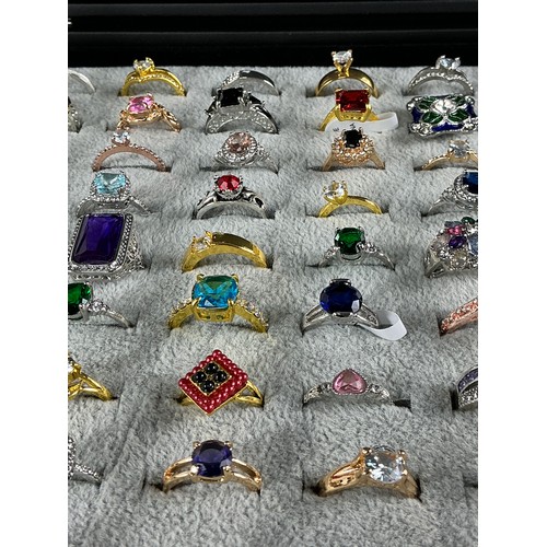 47 - Dealers Tray of Dress Rings - 100 rings of various designs and sizes. Gold and Silver tones with a v... 